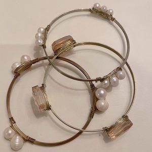 3 bangle bracelets. Pearl and orange stone accents, gold wire bangle.